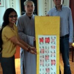 Diamond Sutra scroll being taken around the world by the representatives of the Institute
